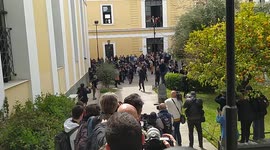 Scuffles break out as mother suspected of killing 9-year-old daughter is arraigned in Athens