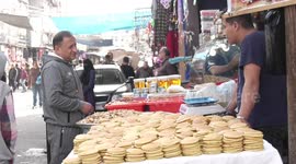 Palestinians shop amid high prices during the Muslim holy month of Ramadan, in Jabalia camp in the northern Gaza Strip.