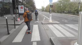 Electric skateboard cruising in Paris. Quai François Mauriac, along the Seine River. From bibliothèque François-Mitterrand to gare Saint-Lazare train station. 4 april 2022