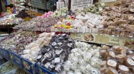 Palestinians shop at a market during near Damascus Gate by the entrance to Jerusalem's Old City, during the Muslim holy fasting month of Ramadan