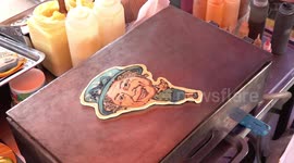 Food seller cooks awesome cartoon pancakes of famous people including The Queen, Boris Johnson and Vladimir Putin
