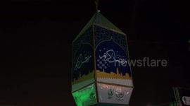 Palestinians attend the lighting of the largest Ramadan lantern in Palestine, during the holy fasting month of Ramadan in the Old City of Jerusalem.