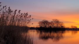 Watch this stunning sunrise at Massapequa Lake in New York