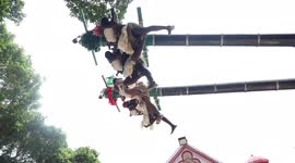 Terrifying ritual sees holy men hoisted 40 feet in air while carrying newborn BABIES