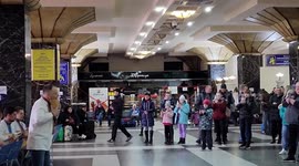 Ukrainians celebrate Russian retreat from Kyiv with musical performance at train station