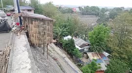 Shocked drivers find shanty homes dangerously built on steep slope in the Philippines