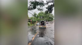 Cyclist crashes while wading on flooded road