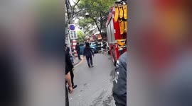 Fire engine smashes past Land Rover illegally parked on road in southern China