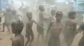 Devotees covered in mud dance themselves clean during ritual in southern India