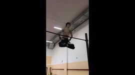Incredible trick on the horizontal bar - the guy hangs on the ribs!