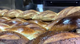 Palestinians prepare bread at a bakery during the holy fasting month of Ramadan