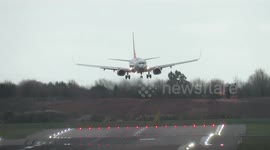 Pilots battle against 55mph winds to land at Birmingham Airport, England