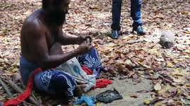 How traditional wadda peoples making fire using 2 rocks