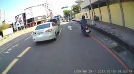 INSTANT KARMA: Moped rider almost got away with running a red light (Dashcam Video)