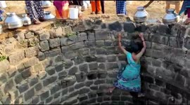 Women from Indian village risk their lives by climbing down well to fetch water