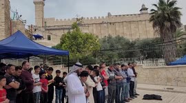 Palestinian Muslim worshippers cross Israeli security barriers to attend first Friday prayers of Ramadan