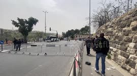 Palestinian Muslim worshippers cross Israeli security barriers as they make their way to attend the first Friday prayers of Ramadan at Jerusalem's Al-Aqsa Mosque
