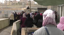 Palestinian Muslim worshippers are pictured at an Israeli controlled Qalandia checkpoint as they make their way to attend the first Friday prayers of Ramadan in Jerusalem's Al-Aqsa mosque