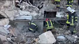 Hundreds of Ukrainian rescuers race to clear rubble from demolished apartment building in Borodyanka