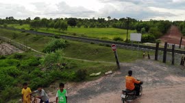 Railway line next to small village in rural northeast Thailand