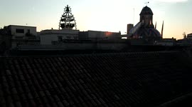 panoramic view of the roofs of the gothic quarter of Barcelona, with the palace of the generalitat and the cathedral at dawn,