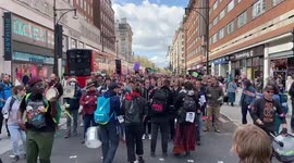 Thousands of Extinction Rebellion protesters march through Oxford Street in London
