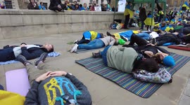 Hundreds Ukrainians diein and mother in fake blood protest Russian invasion, London, UK