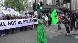 Extinction rebellion activists sing and dance for climate justice