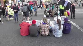 extinction rebellion read news papers and leave graffiti in the road