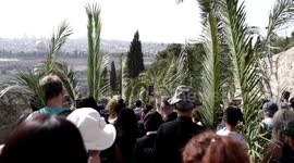 Christians take part in the traditional Catholic Palm Sunday procession in Jerusalem