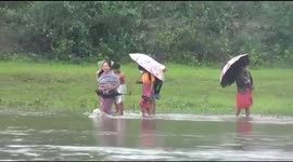 Watch -With no bridge, students force to cross river to reach school in Assam’s Jonai