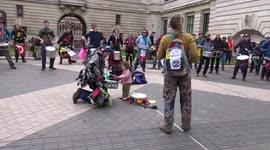 Cute moment baby tries drumming at Extinction Rebellion protest in South Kensington