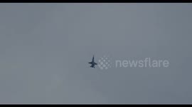 jawdropping looping flight by swiss airforce Boeing F/A-18 Hornet fighter plane high over swiss Alps