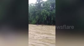 Students saved after being trapped in overflowing river in the Philippines