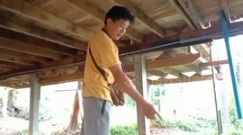 Female snake catcher drags massive python out of family's pond