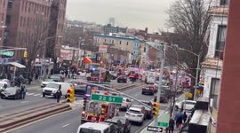 Emergency vehicles crowd Brooklyn street after NYC subway shooting