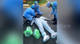 Shanghai COVID-19 worker suffers from heatstroke while delivering supplies to residents in lockdown