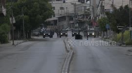 Palestinian protesters clash with Israeli forces, in the West Bank city of Nablus