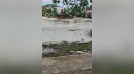 Boats carrying relief goods crash into bridge during Tropical Storm Megi floods in the Philippines