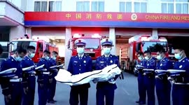 Firefighters in China hold funeral procession to bid farewell to 8-year-old rescue dog