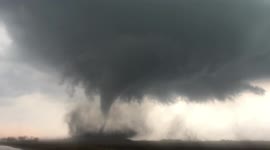 'Wow!' Iowa motorist reacts as he captures huge tornado twisting across fields