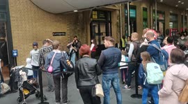 Madness Fans queues at the Harry Potter shop to take photo m 9 3/4 at, King Cross Station, London
