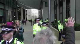 Extinction  rebellion protest shell office in london gluing hands to to ground