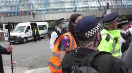 protester arrested no handcuffs taken a minibus extinction rebellion shell offices
