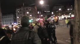 female protester carried out of the road shouts for my son Trafalgar square