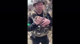 Rescuers pull puppy from rubble of Russian shelling and reunite it with elderly owner