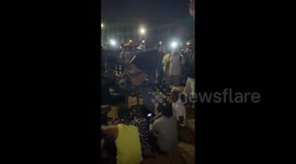 People sing at the protest In Colombo, Sri Lanka