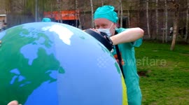 Planet emergency from Xr rebellion rally at Tate modern riverside ;Londons southbank