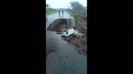 Road broke down as the car drove over. This happened at Adams not far adams college.