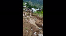 Shacks washed down by floods